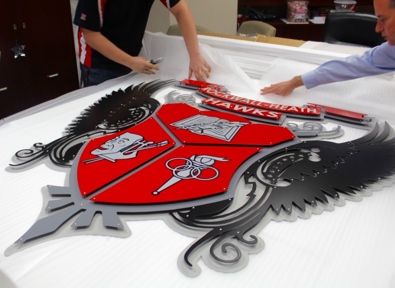 New Rockwall-Heath crest presented to Dr. Maglisceau