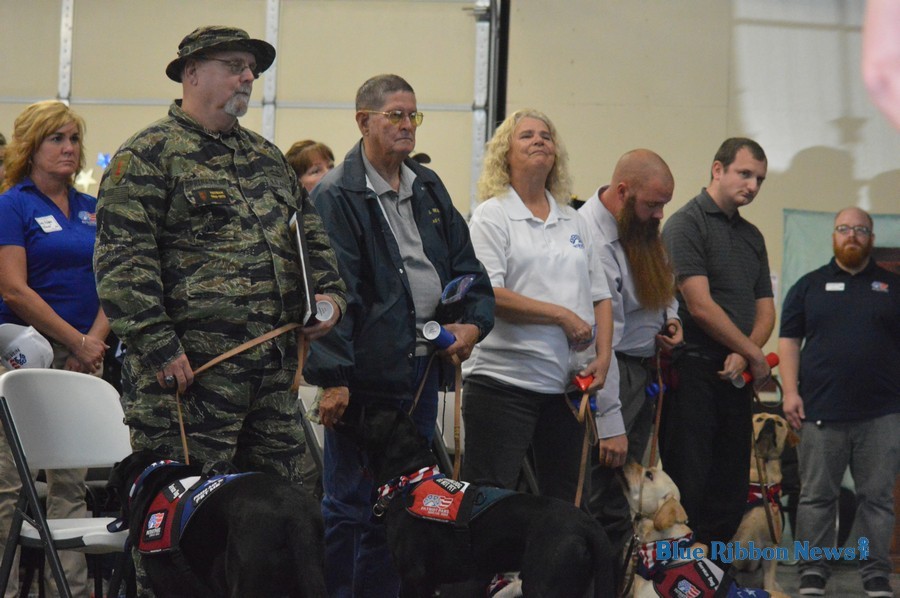 Veterans reunite with service dogs at Patriot PAWS graduation