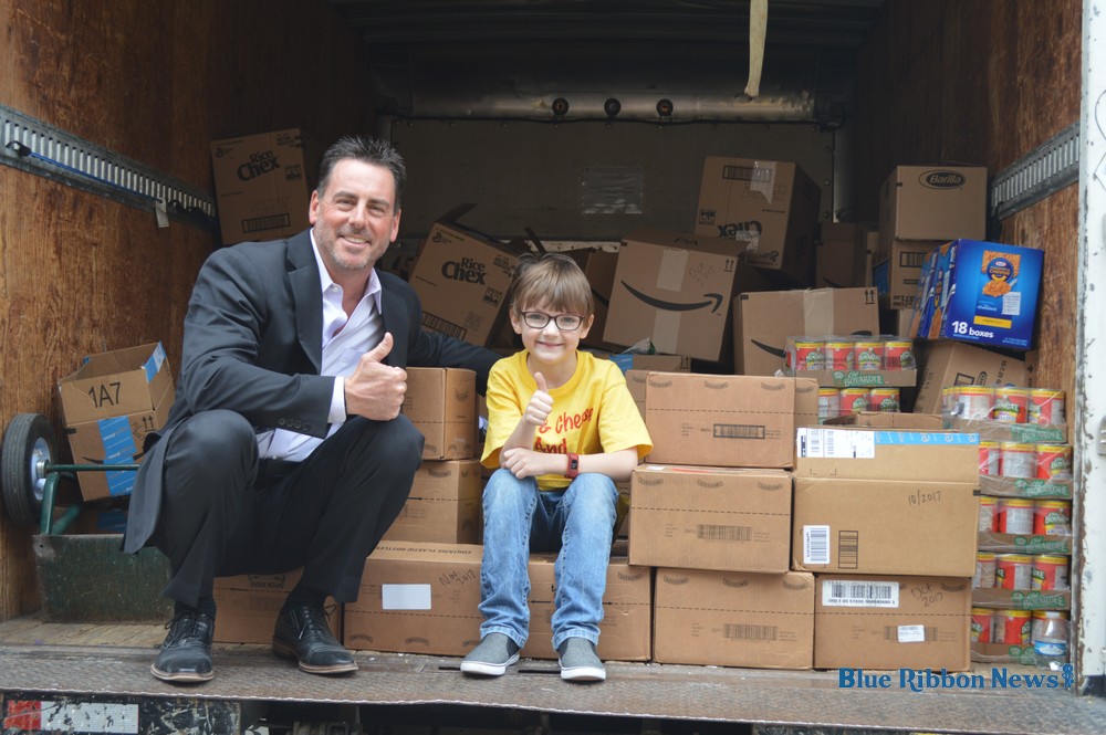 Local boy’s nonprofit collects thousands of food items for kids in need