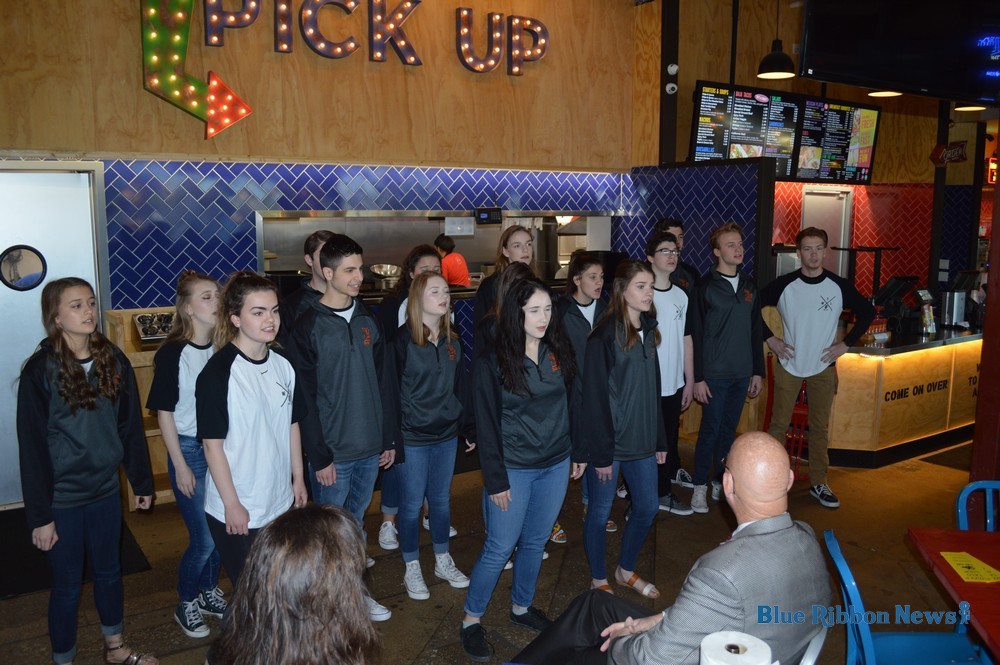 Chamber welcomes RHS a cappella group, motivational speaker at partnership breakfast