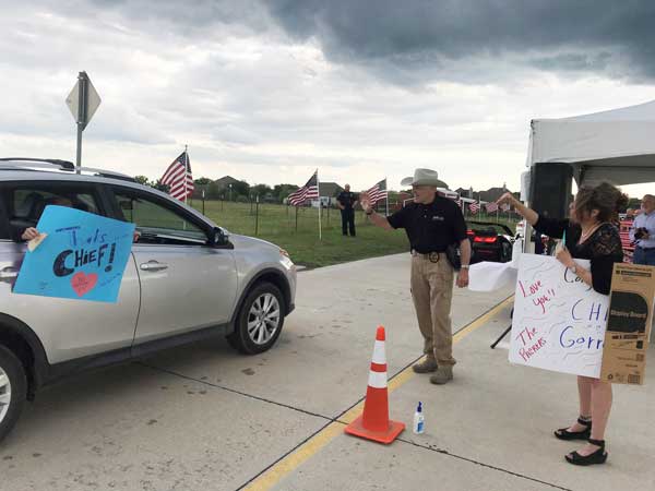 Heath bids farewell to retiring DPS Chief with surprise drive-by parade