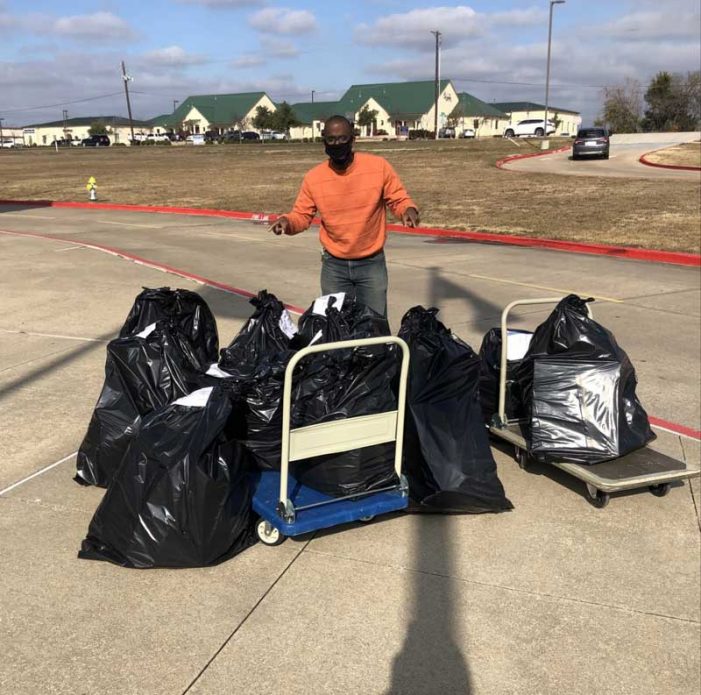 Cain Middle School families receive Christmas donations from KE Andrews of Rowlett