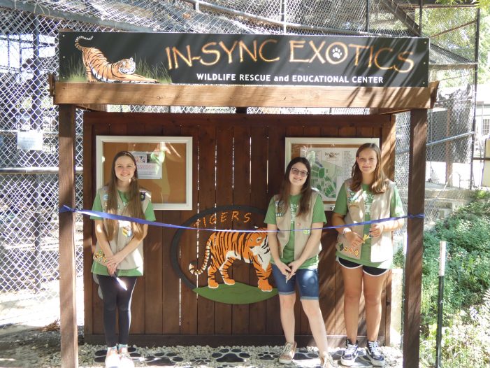 Ribbon cutting recognizes Girl Scout Silver Award project at In-Sync Exotics