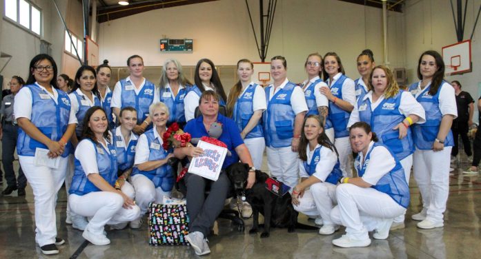 Offender trainers bid farewell to service dogs they trained & the woman who took a chance on them