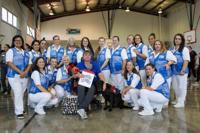 Offender trainers bid farewell to service dogs they trained & the woman who took a chance on them